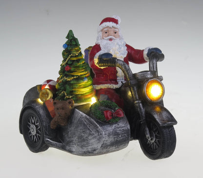 Santa na motorce s postranním vozíkem - vánoční vesnice